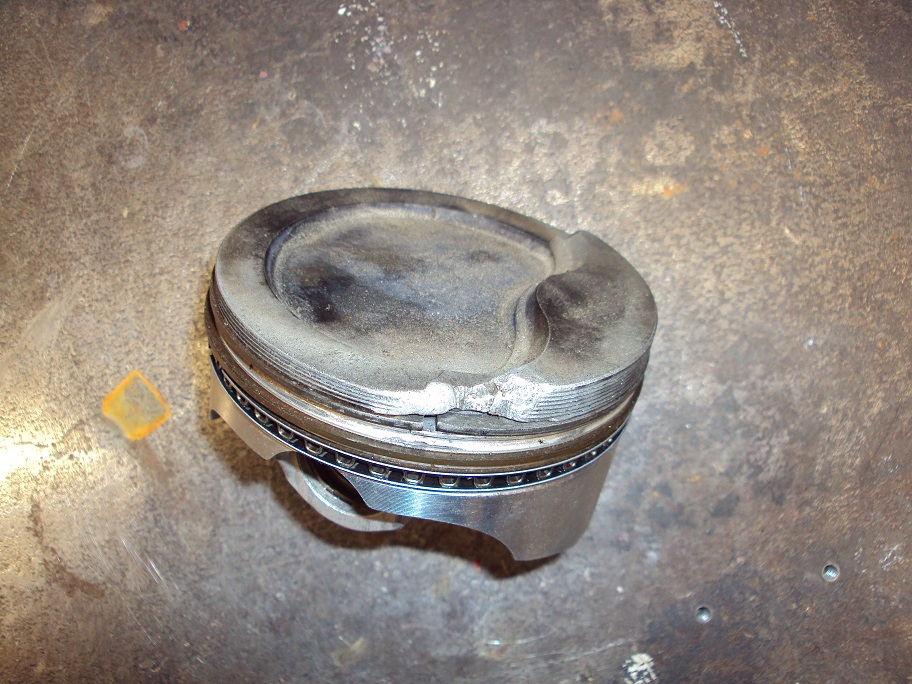 Attached picture melted piston.jpg